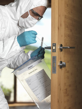 Forensic officer taking DNA swab off door handle