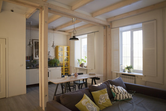 View of couch, dining area and kitchen