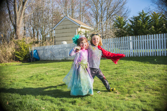 Children in costumes playing outdoors