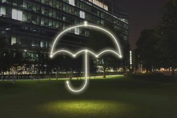 Glowing umbrella symbol in city at night