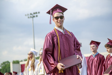 Portrait of young man at graduation ceremony