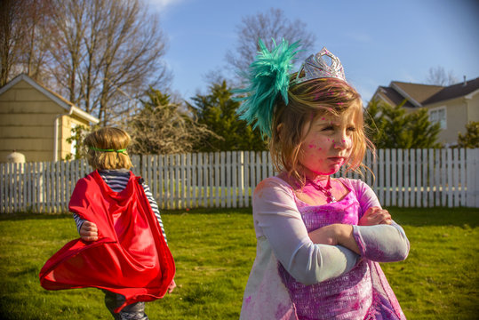 Children in costumes sulking after fight