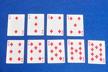 Playing card. Two to ten of diamonds isolated on a blue background