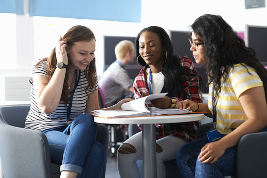 Teenage girls working together in class