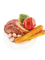 Raw seasoned rib eye steak