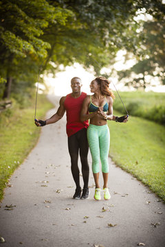 Young couple training on path skipping in unity