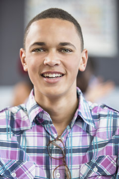 Portrait of male student in classroom