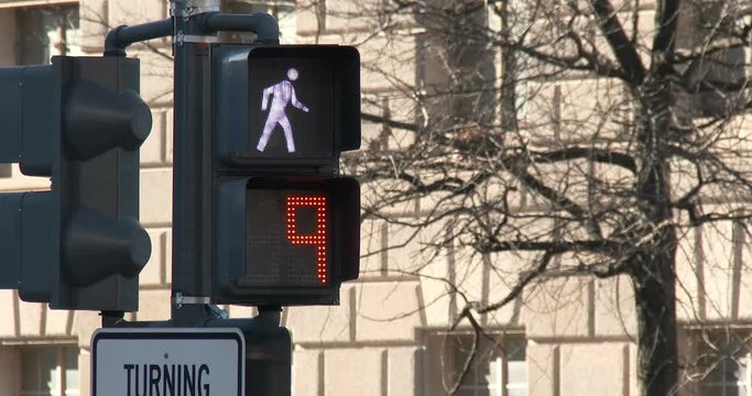 Crosswalk signal flashing to warn people not to cross.