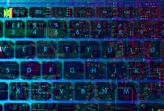 Double exposure of the inside and out of a laptop computer showing the electronic components under the keyboard