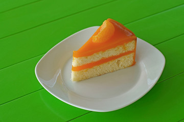 orange cake on white plate