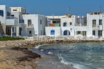 Old white house and Bay in Naoussa town, Paros island, Cyclades, Greece