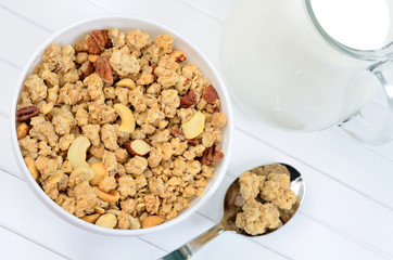 Healthy muesli in bowl with milk