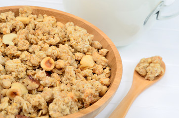 Milk with muesli in a bamboo bowl