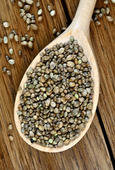Hemp seeds in a wooden spoon