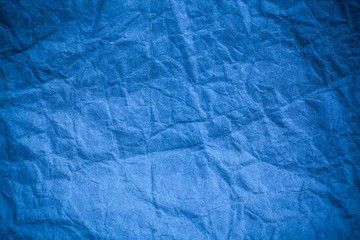 Blue crumpled eco paper background.