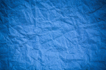 Blue crumpled eco paper background.