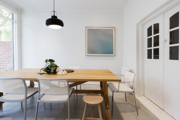 Obraz na płótnie Canvas Modern scandinavian styled interior dining room with pendant lig
