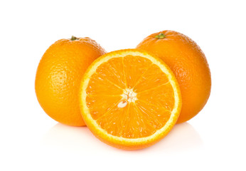 whole and cut ripe orange on white background