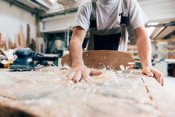 Carpenter and wood shavings from skateboard