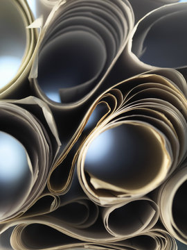 Full frame view through rolled up architectural drawings