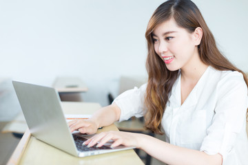 young beautiful asian girl student in classroom