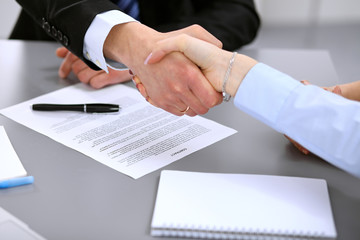 Business people shaking hands , finishing up a meeting to sign a new contract