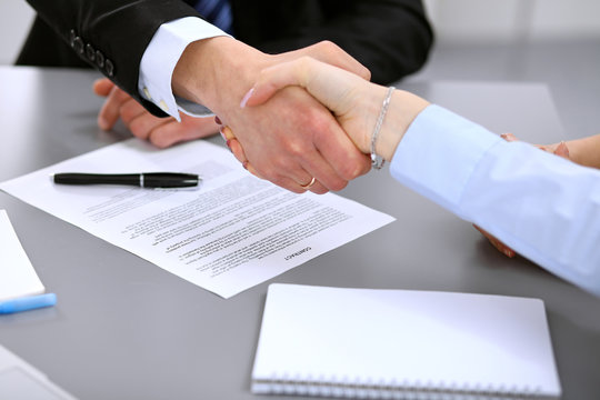 Business People Shaking Hands , Finishing Up A Meeting To Sign A New Contract