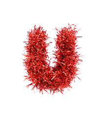 Tinsel Christmas decoration in form of U. On a white background