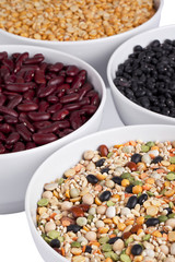 close up image of assorted beans on white bowl