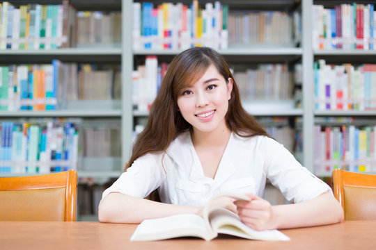 Young Beautiful Asian Girl In School Library