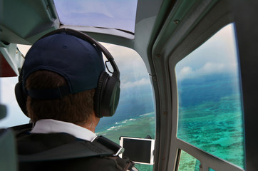 Person fly in helicopter above the Great Barrier Reef