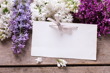 Background with fresh aromatic lilac flowers  and empty tag