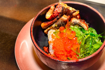 salmon caviar and grilled eel with sauce on rice. Japanese cuisine , Selective focus and close up