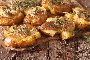 Tasty hot baked new potato with thyme close-up. horizontal
