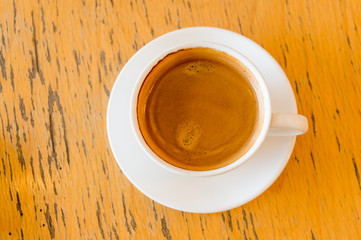 Top view cup of coffee on wooden table