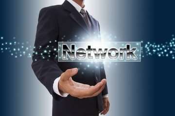 Businessman hand showing network button on virtual screen.