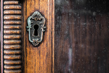 Keyhole of antique wooden cabinet