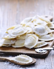 Homemade ravioli on wooden board