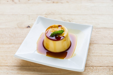 Pudding Caramel Custard in white plate.