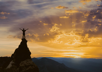 man on the top of a rock