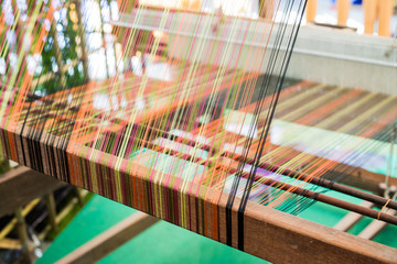 Detail of weaving loom for homemade silk or textile production