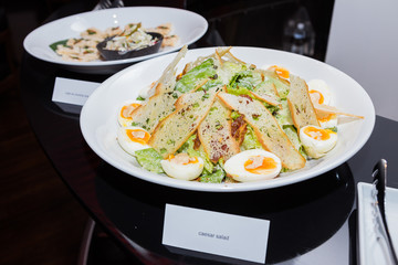 The Caesar salad prepared on the classical recipe