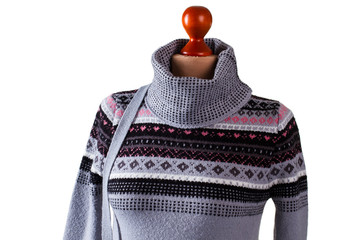 Warm gray high collar sweater. Warm sweatshirt on headless mannequin. Stylish handmade pullover in workshop. Lady's custom made woolen garment. - obrazy, fototapety, plakaty