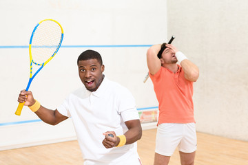 Men playing squash