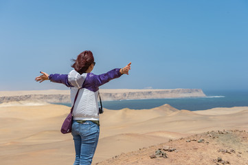 A Girl enjoy desert clift view point at the Paracus National Res