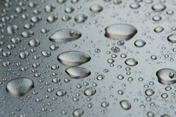 Water drops on the metal closeup