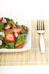 spinach with slice strawberries