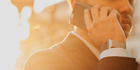 Man in suit talking on mobile phone