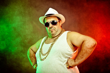 italian funny mafia boss rapper with undershirt and sunglasses on smoky background - obrazy, fototapety, plakaty