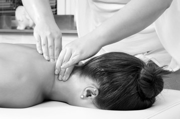 Obraz na płótnie Canvas Young women getting neck massage in beauty spa.